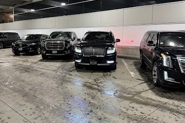 Luxury black SUVs parked indoors, showcasing a professional car service in Portland, Oregon